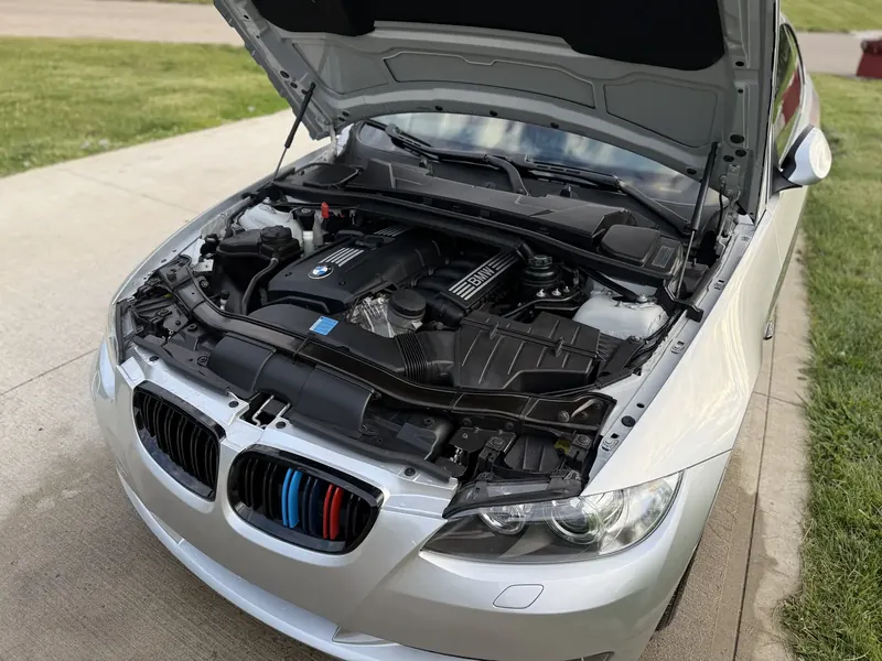 Engine bay — cleaned & dressed — by Wax N' Go Mobile Detailing